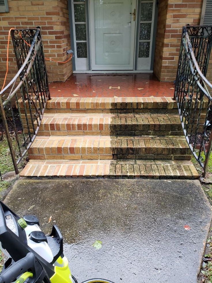 Pressure washing brick steps — half cleaned